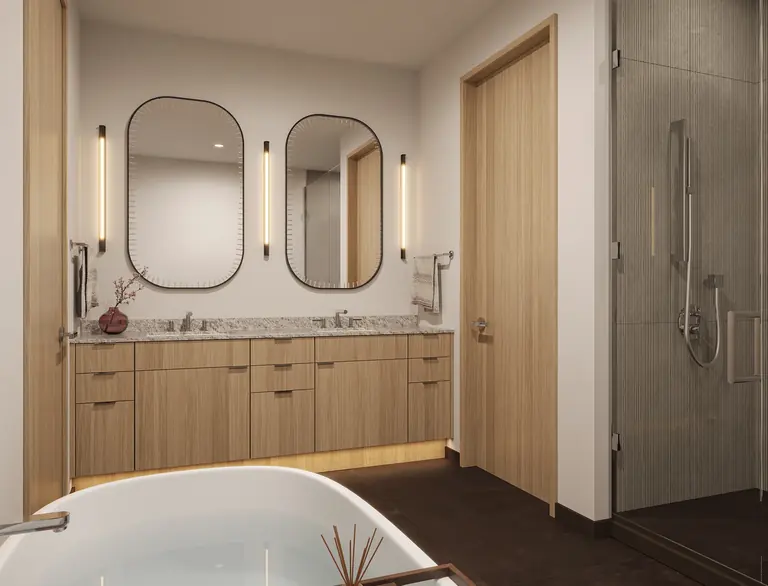 Primary bathroom with double vanity, soaking tub and glass shower